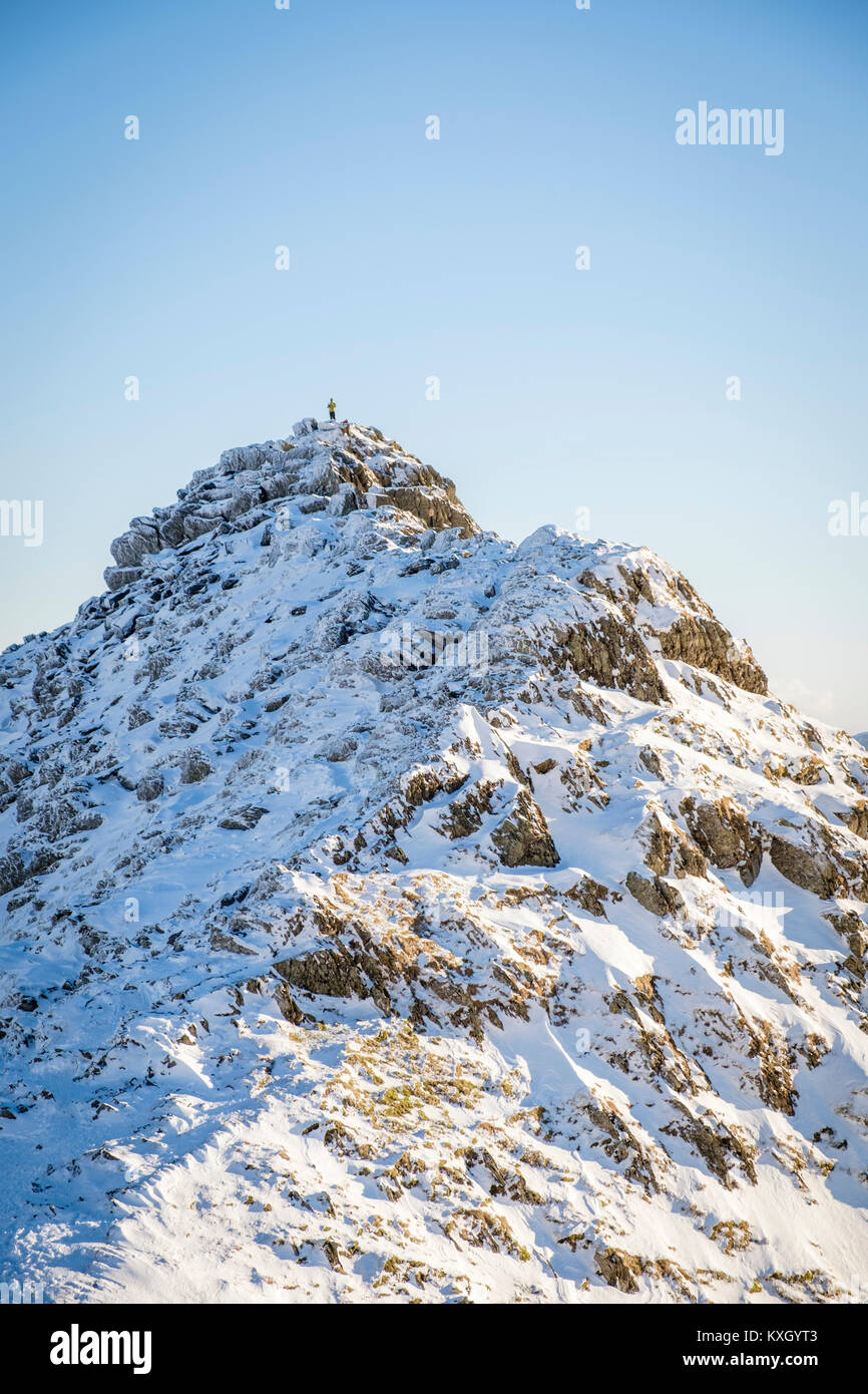 Heeling Ridge A Mountaineer taking on Striding Edge Ridge on The Helvellyn Mountain ...