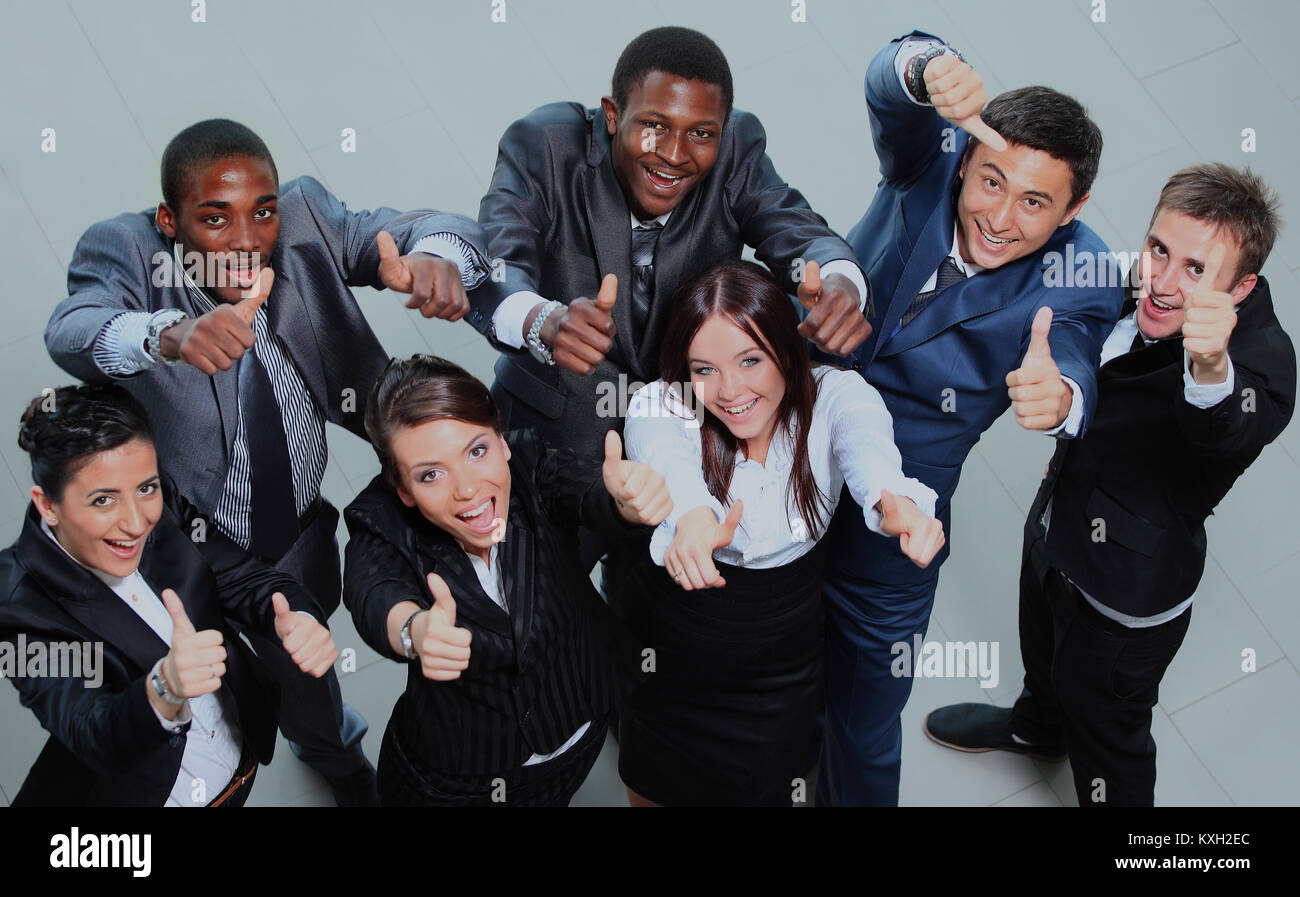 Top view of executives smiling and pointing Stock Photo - Alamy