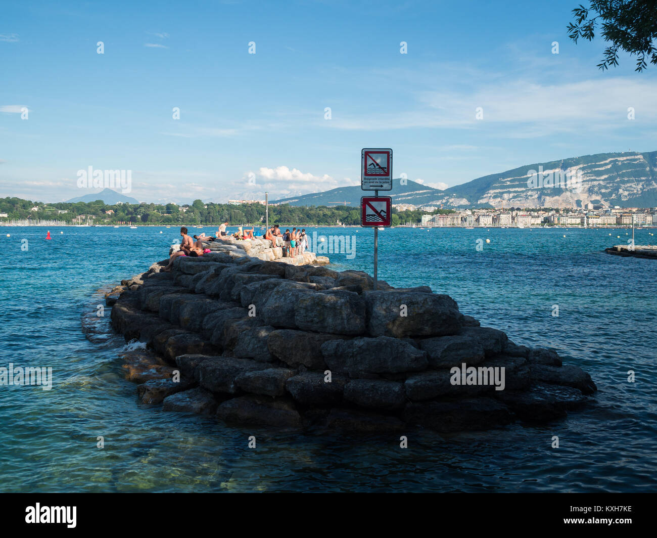 People in the sun in Lake Geneva Stock Photo