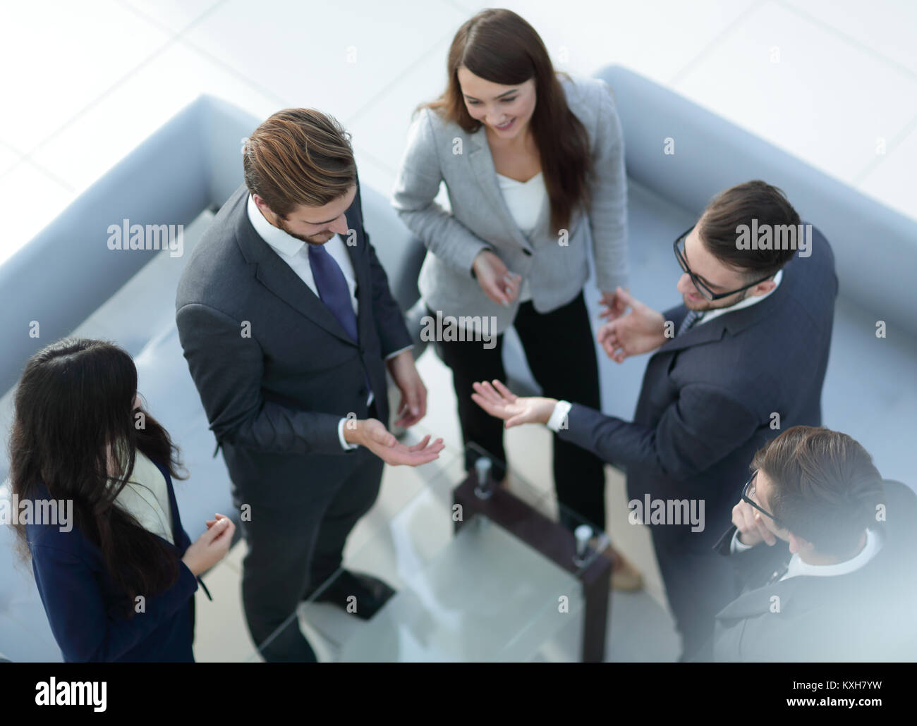 Happy smiling business team standing in a row at office Stock Photo - Alamy