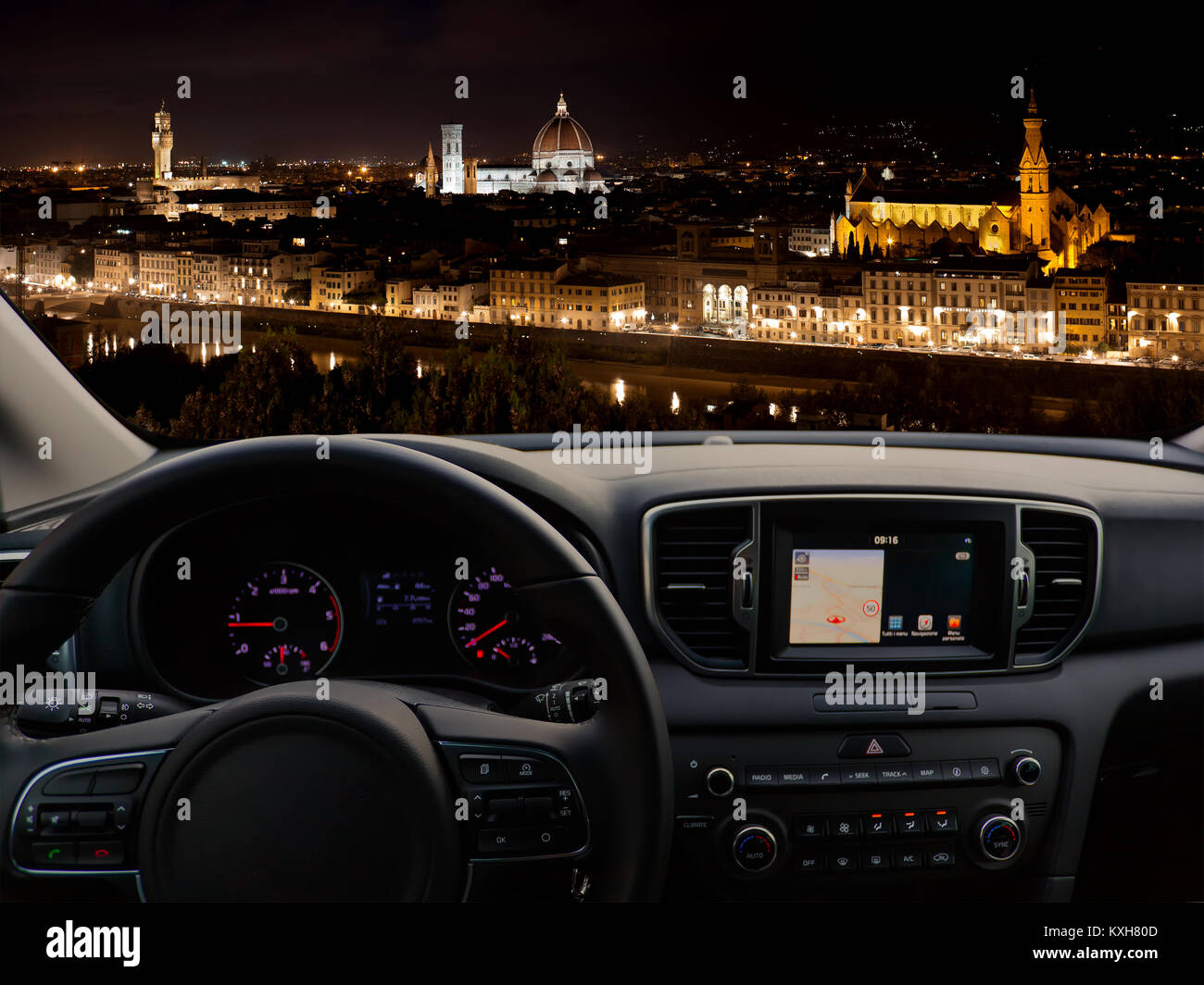 View of a car dashboard with a navigation unit traveling to Florence Stock Photo