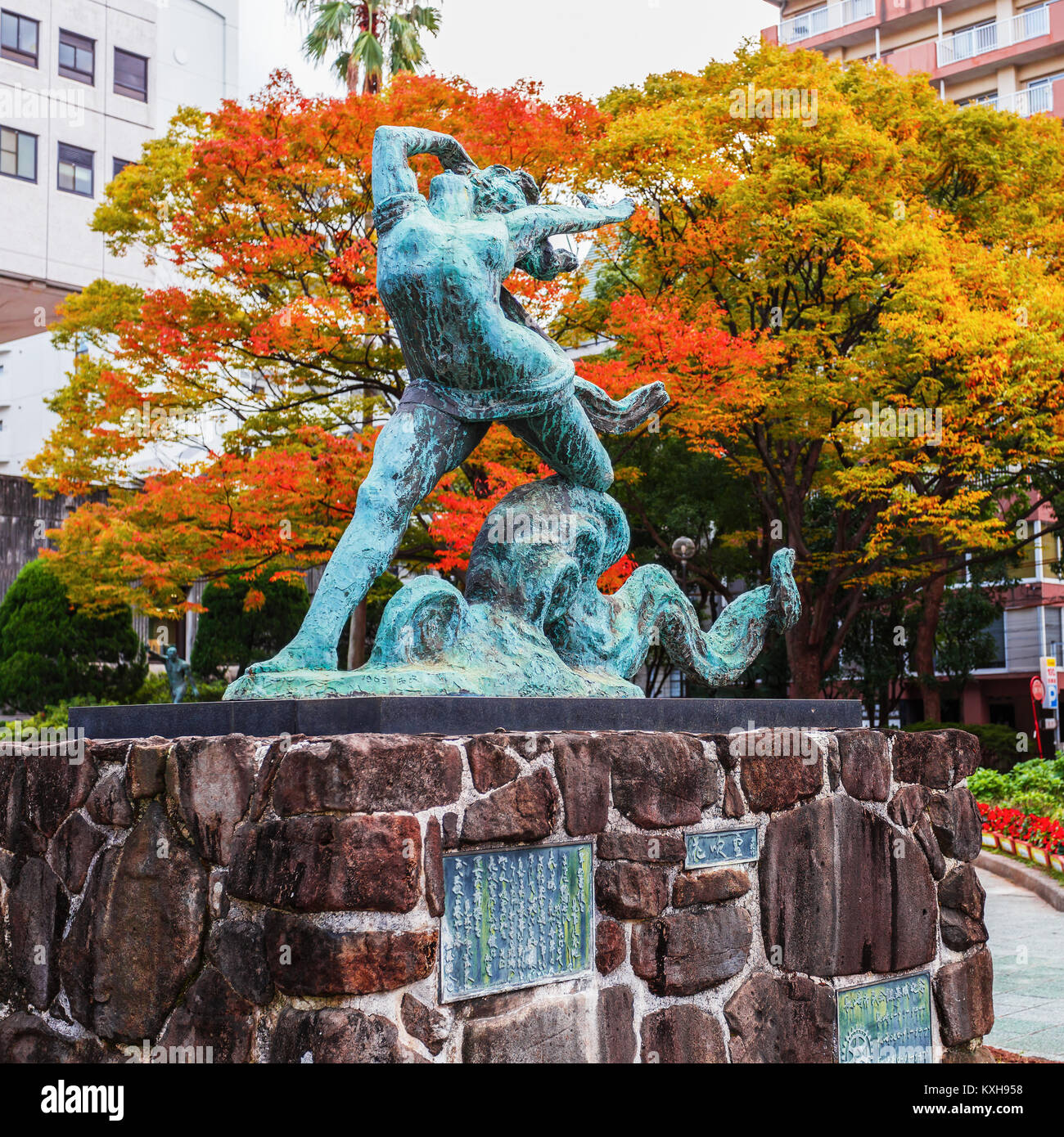 Nagasaki, Japan - November 14 2013: Girl and Octopus sculpture created in 1965, situated infront of Nagasaki Civic Center building which is in the are Stock Photo