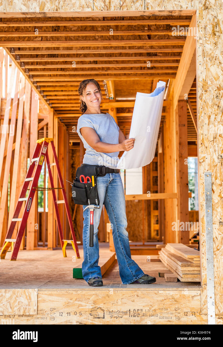 Pretty woman construction tools belt hires stock photography and