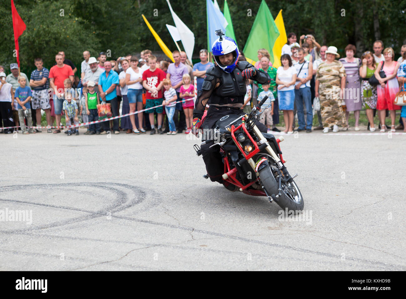 Verkhovazhye, Vologda region, Russia - August 10, 2013: Riding on a motorcycle without arms. Alexei Kalinin. Champion of the Baltic States 2005 Bronze Stock Photo