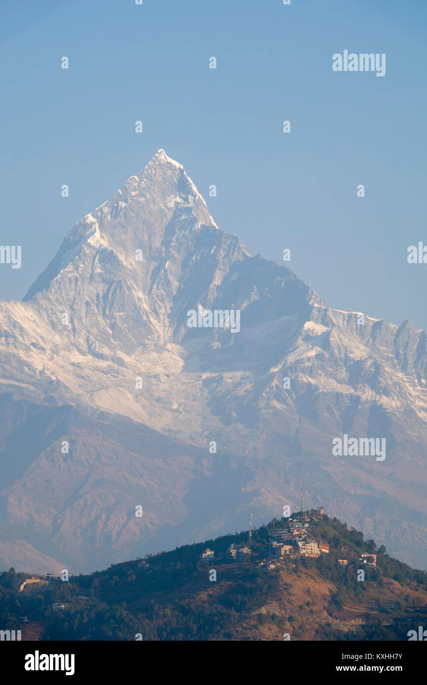 View of Sarankot dwarfed by Machapuchare (Fishtail) mountain in the Annapurna massif, Nepal Stock Photo