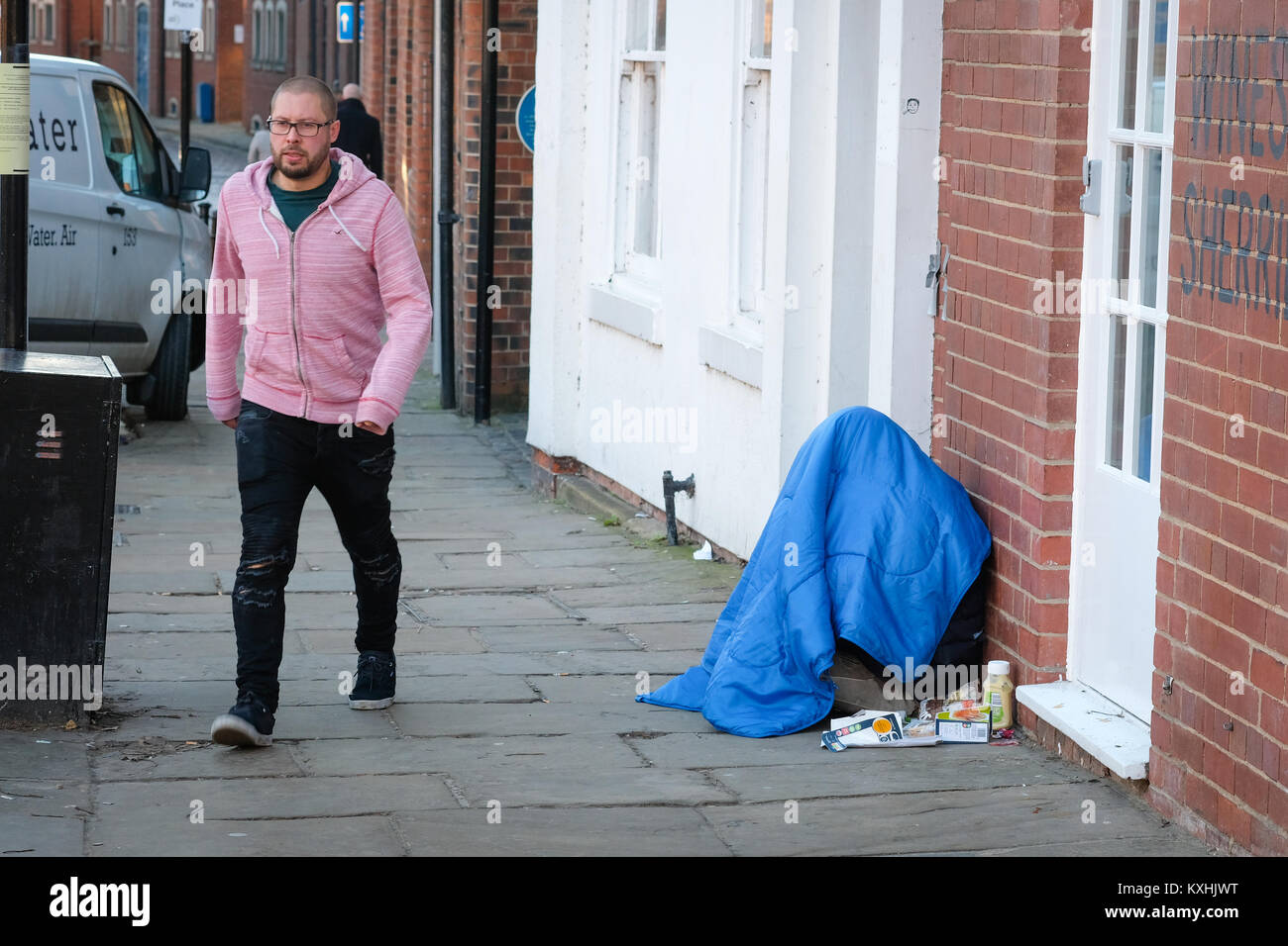 Homeless person in sleeping bag in freezing temperatures, The Calls