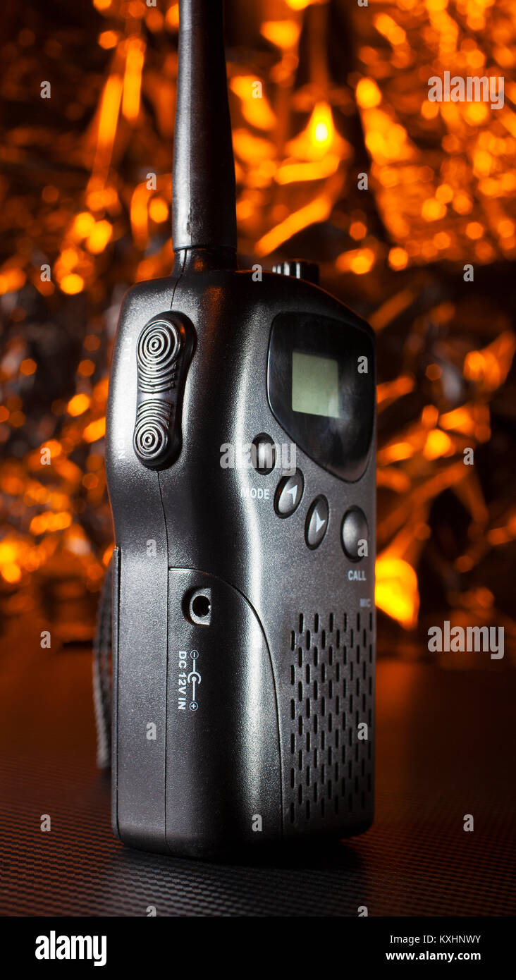 Walkie-talkie for the multiple use radio system with an orange background Stock Photo