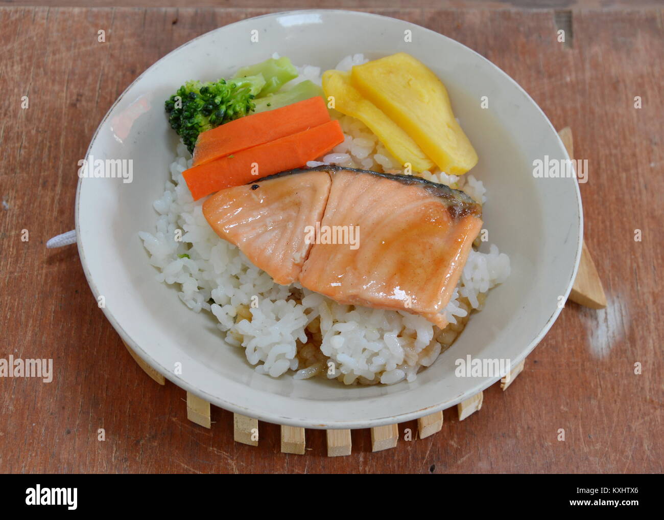 grilled Salmon dressing sauce topping on Japanese rice Stock Photo Alamy