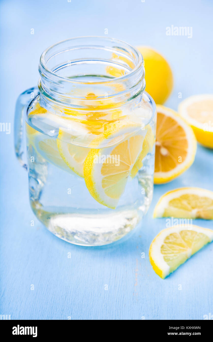 Refreshing ice cold water with lemon ready to drink. Concept of diet.  Diet for weight loss. Stock Photo