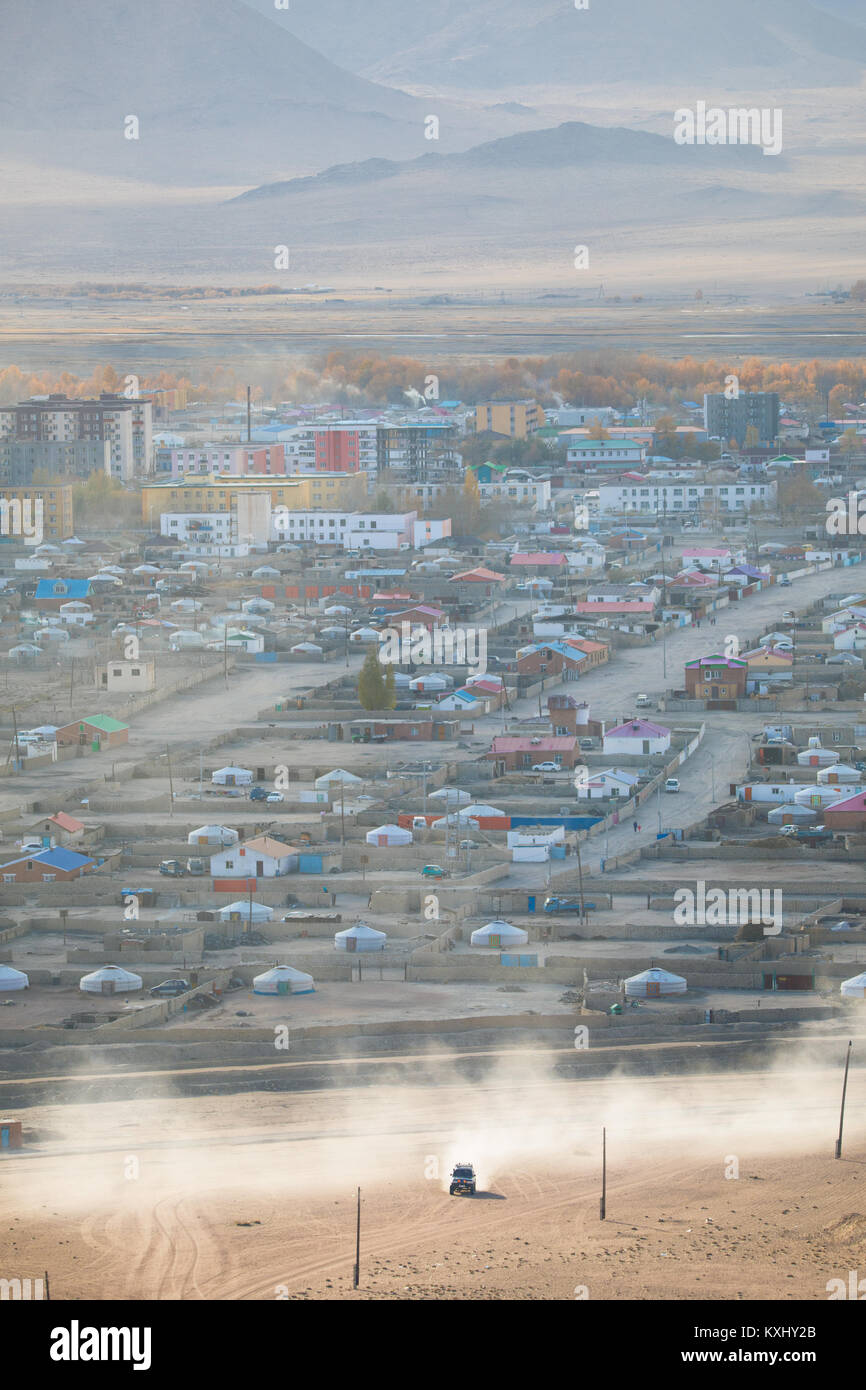 Khovd Hovd town city sunset smoke chimneys burning coal to stay warm and in cold Mongolian winter Stock Photo
