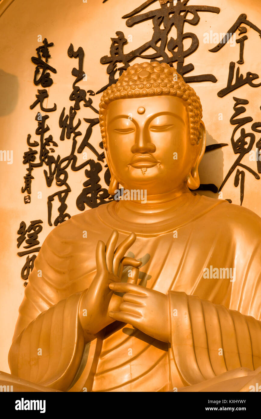 Golden Buddha statue at World Peace Pagoda, Pokhara, Nepal Stock Photo