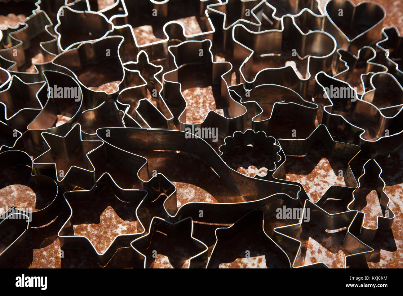 Full frame shot of various cookie cutters on table Stock Photo