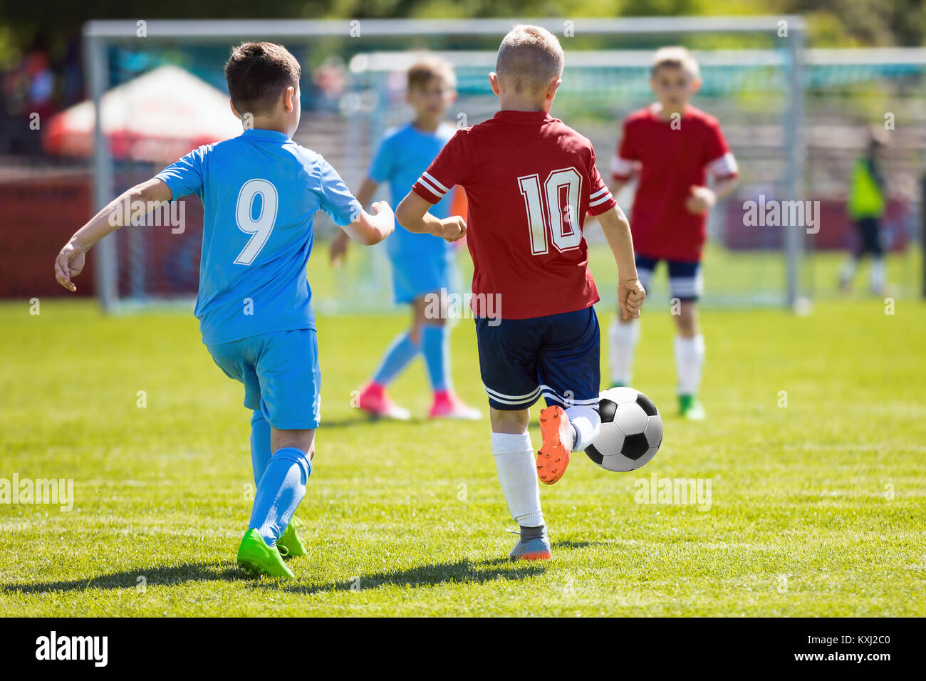 Running Soccer Football Players. Footballers Kicking Football Match