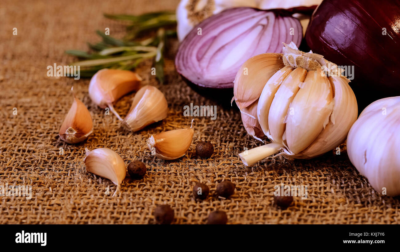 Garlic and cloves lying on a napkin. Healthy food and spices. Ad Stock ...