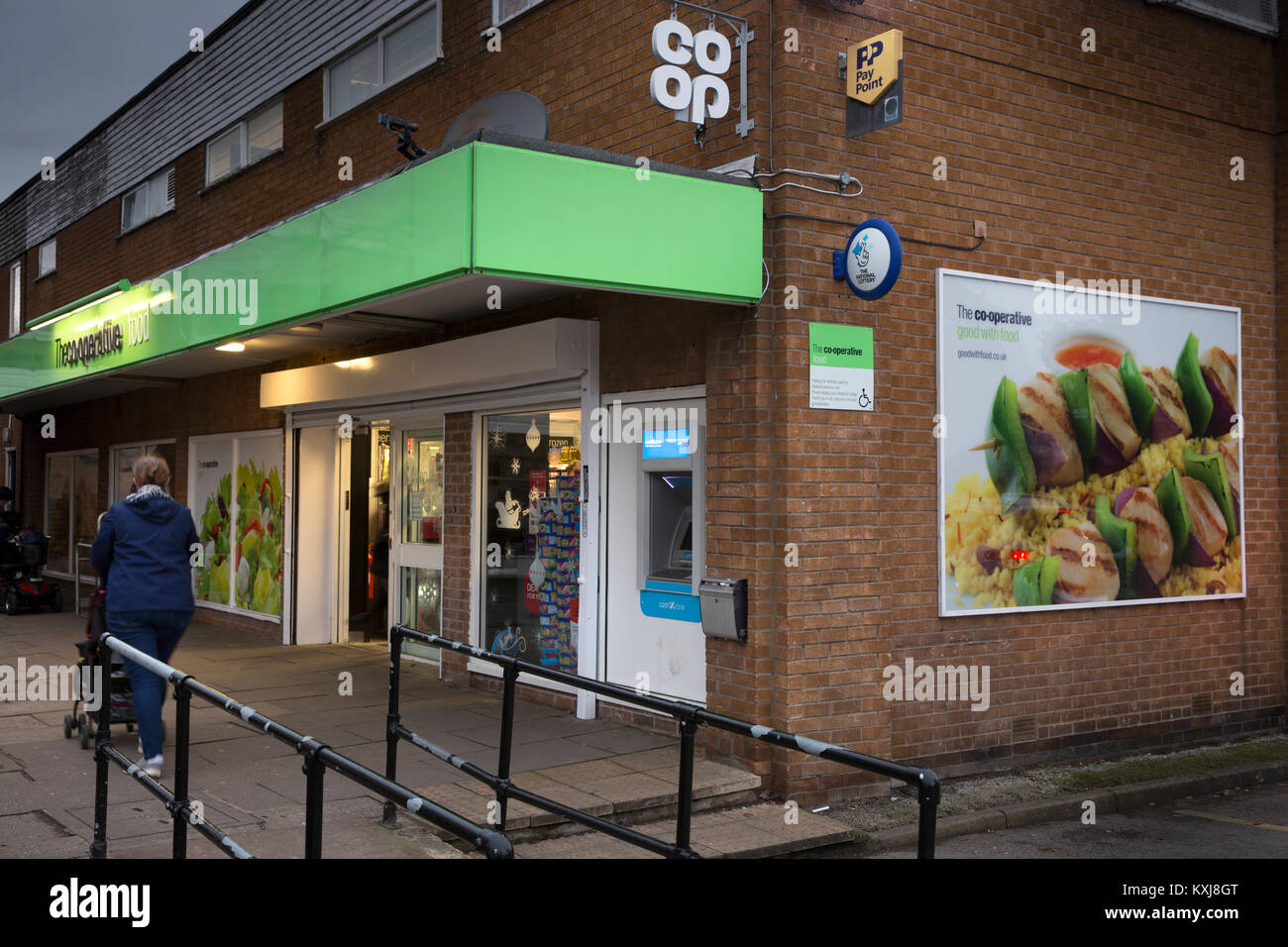 UK, England, Cheshire, Stockport, Bramhall, Dairyground Road, Co-op food store, with new cloverleaf logo sign Stock Photo