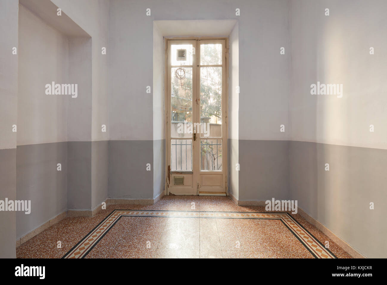 Empty room interior with tiled floor and window with balcony Stock Photo