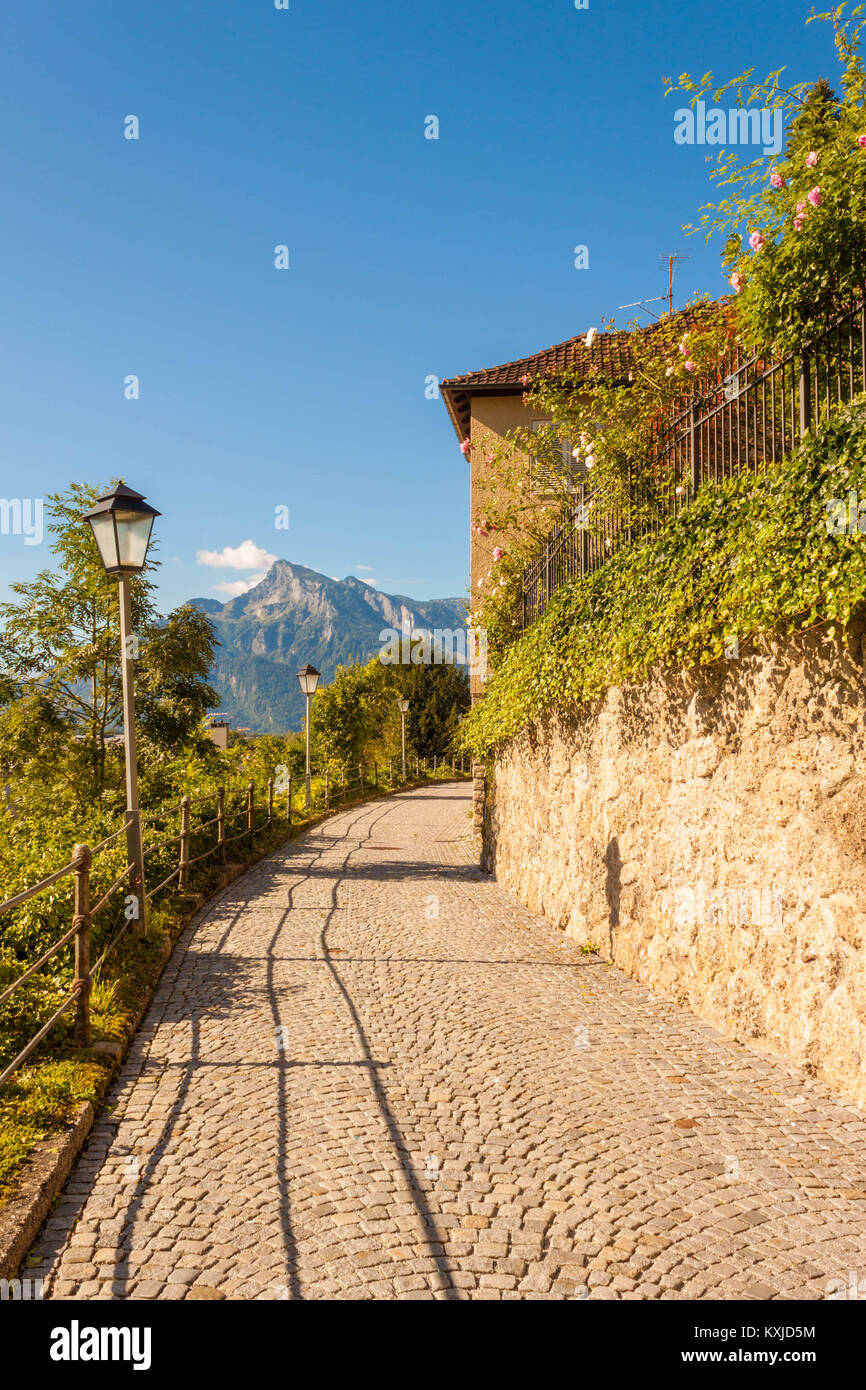 Beautiful sett road with street lamps on the side of the Nonnberg hill ...