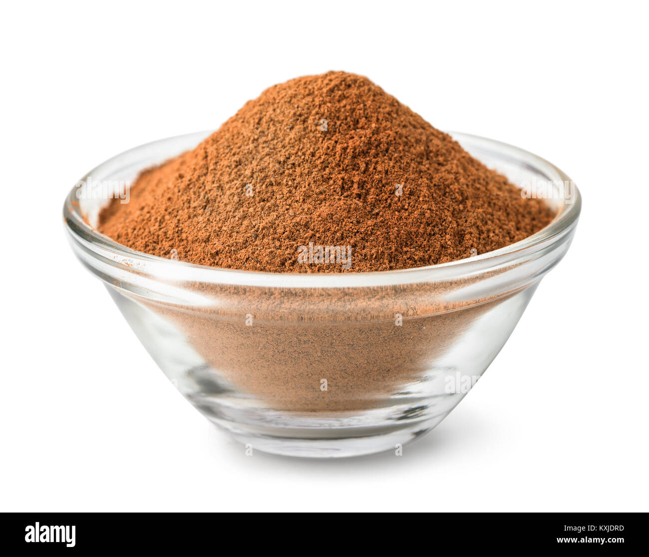 Glass bowl of ground cinnamon isolated on white Stock Photo
