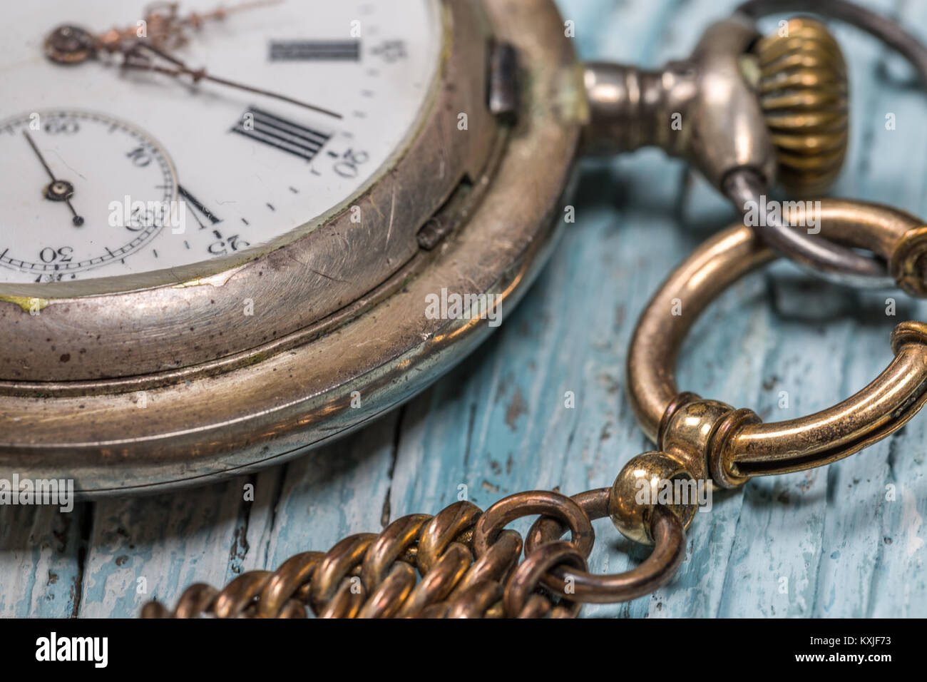 Close-Up image of Old pocket watch on wooden table Stock Photo