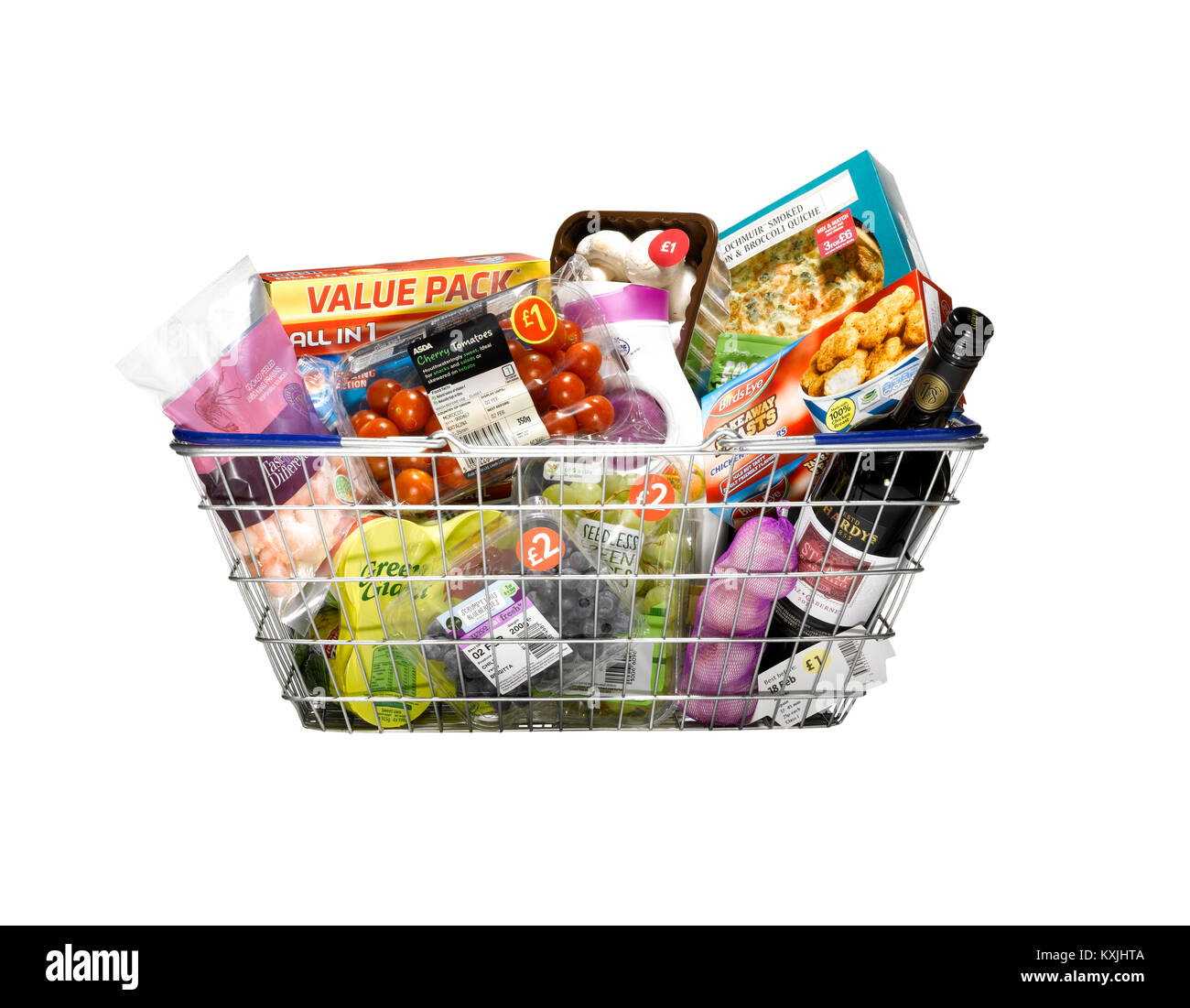 A cut out shot of a shopping basket full of groceries Stock Photo