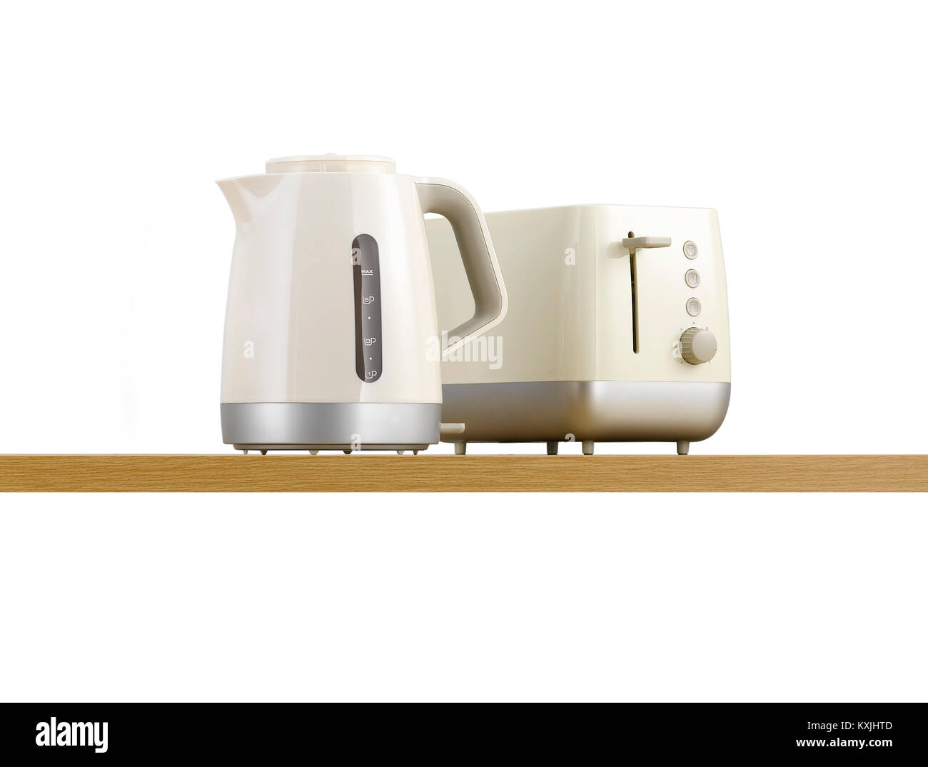 A kettle and toaster on a wooden kitchen shelf Stock Photo
