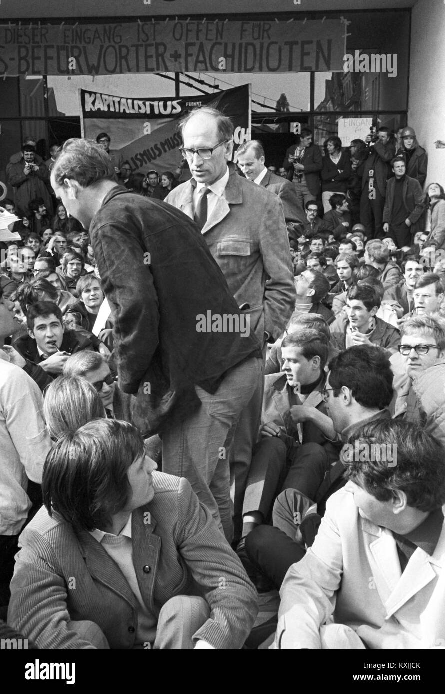 Prof. Walter Rüegg, head of university, leaves the building through the blocked main entrance during a sit-in of students as a protest against the state of emergency on 24 May 1968. | usage worldwide Stock Photo