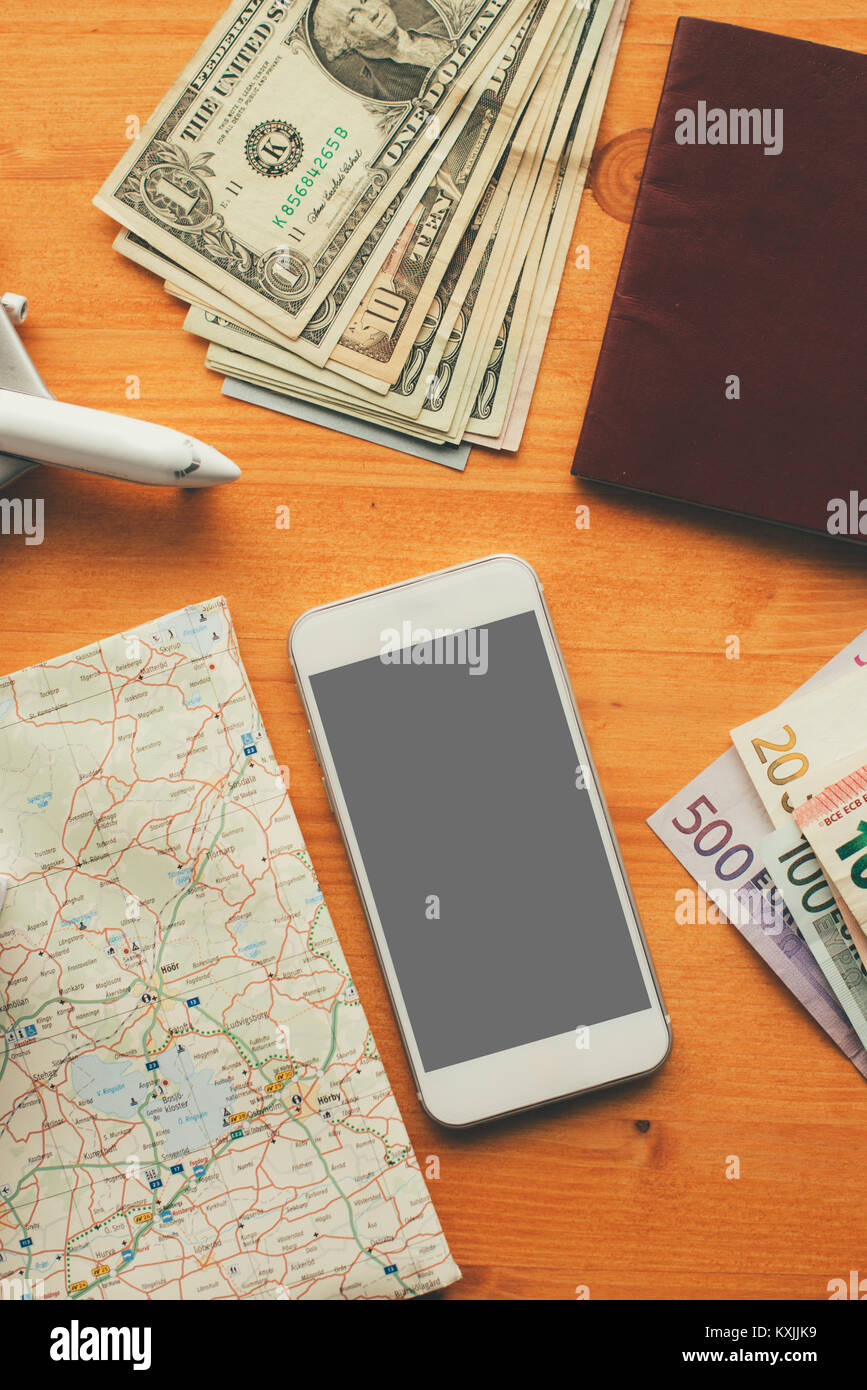 Overhead view of vacation travel concept with smartphone blank screen as mock up copy space for hotel reservation and booking mobile app or airplane t Stock Photo
