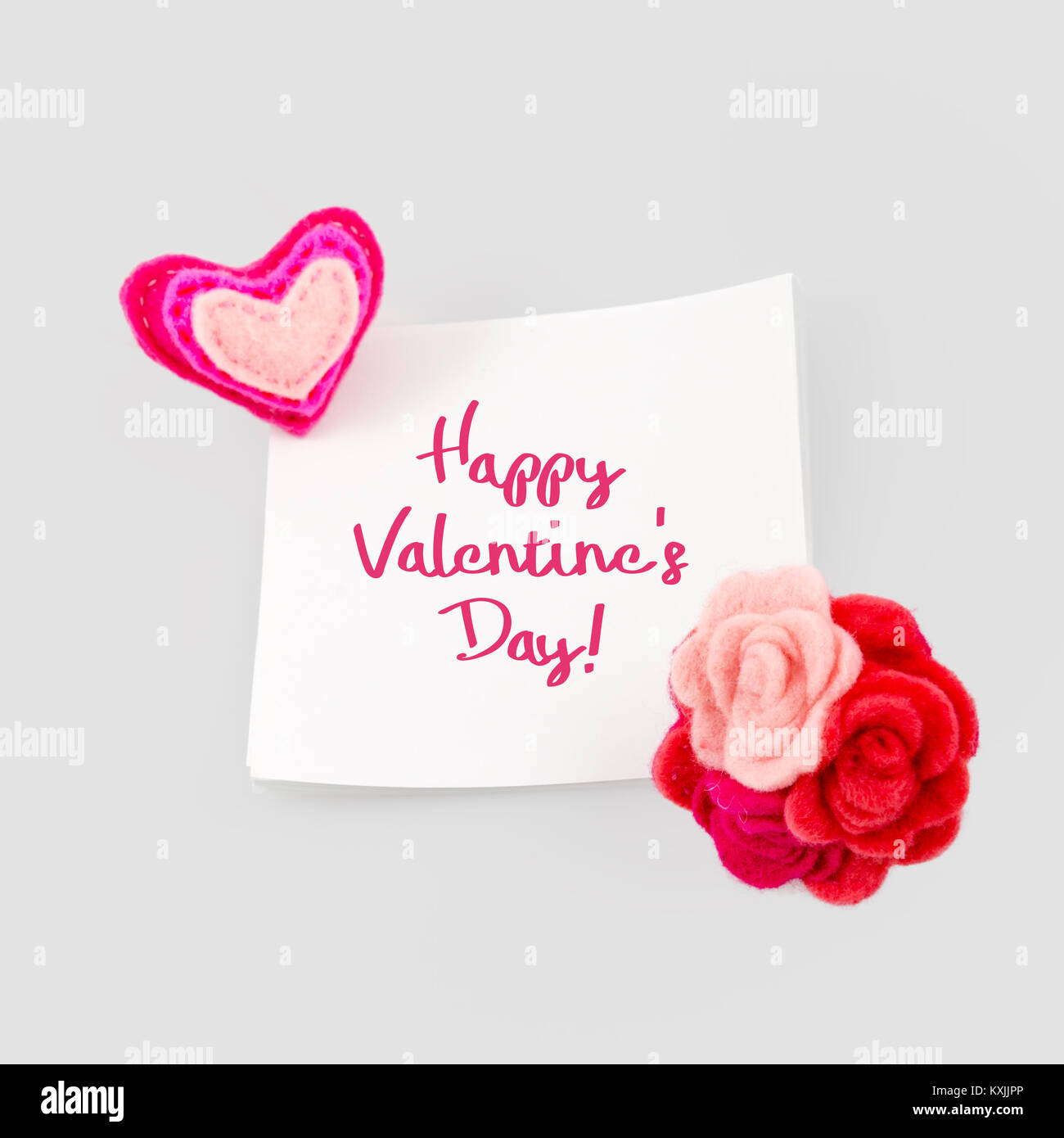 Happy valentines day greeting card. Heart and love message on stick note paper Stock Photo