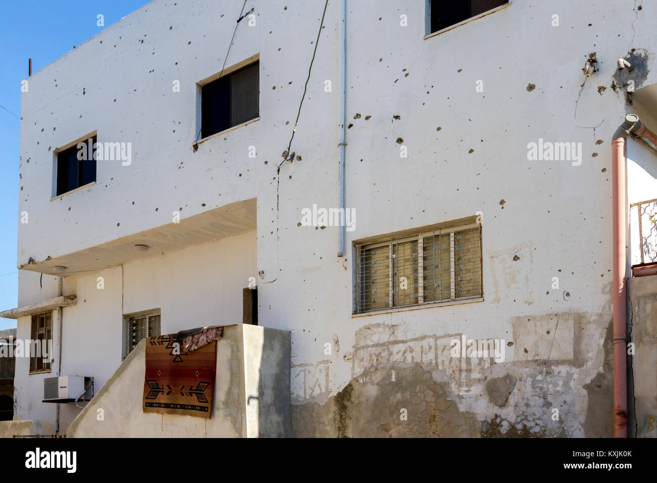 Jenin, Palestine,January 11, 2011: House wounded by gun shot and artillery during Palestinian intifada in Jenin refugee camp Stock Photo