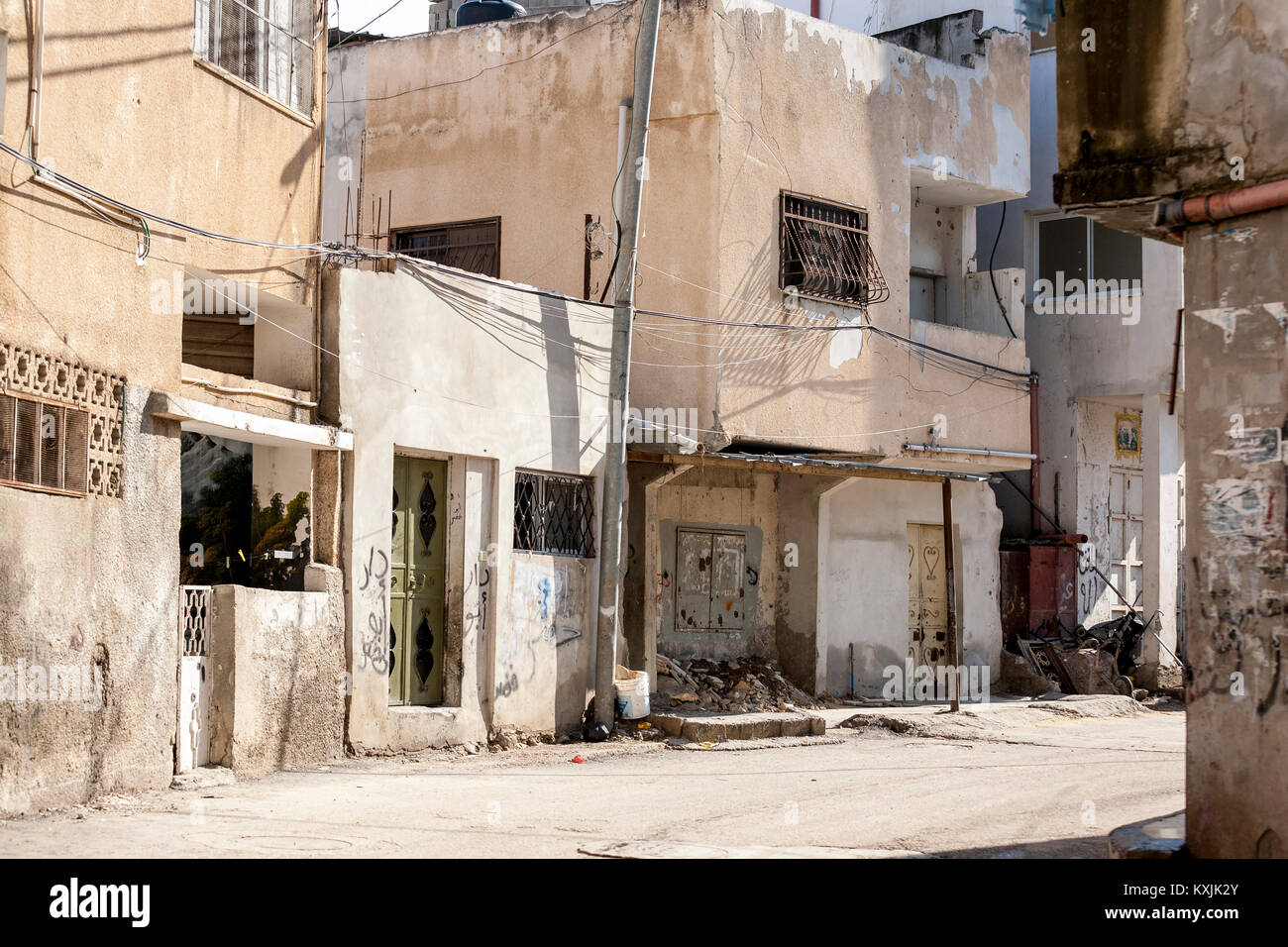 Jenin, Palestine, January 11, 2011: Street in Jenin refugee camp. Most of the houses are in poor condition. Stock Photo