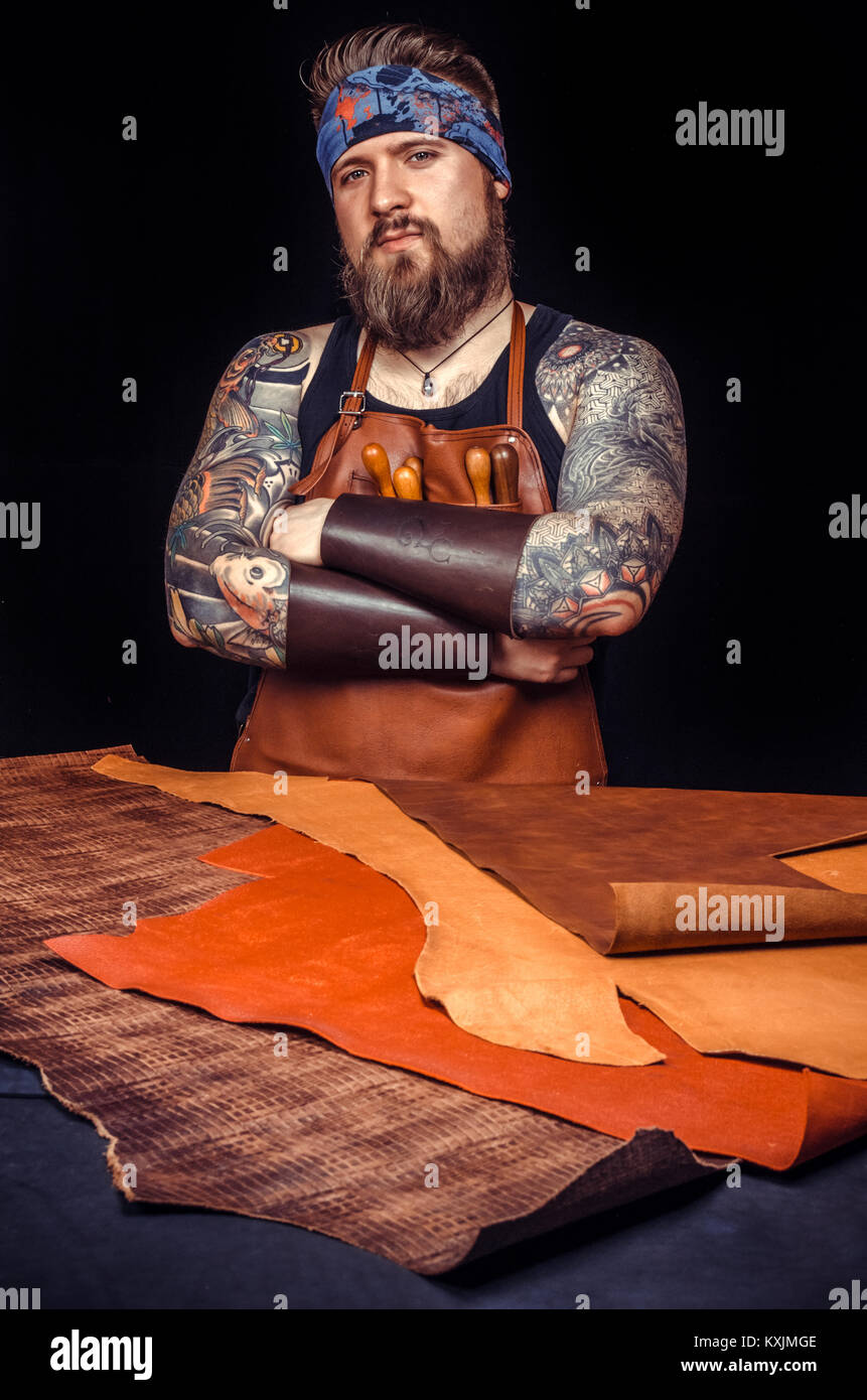 Leather goods craftsman at work in his hires stock
