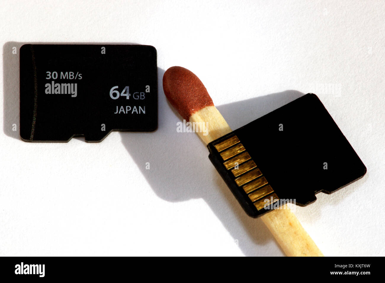 Micro sd cards in relation to a match Stock Photo