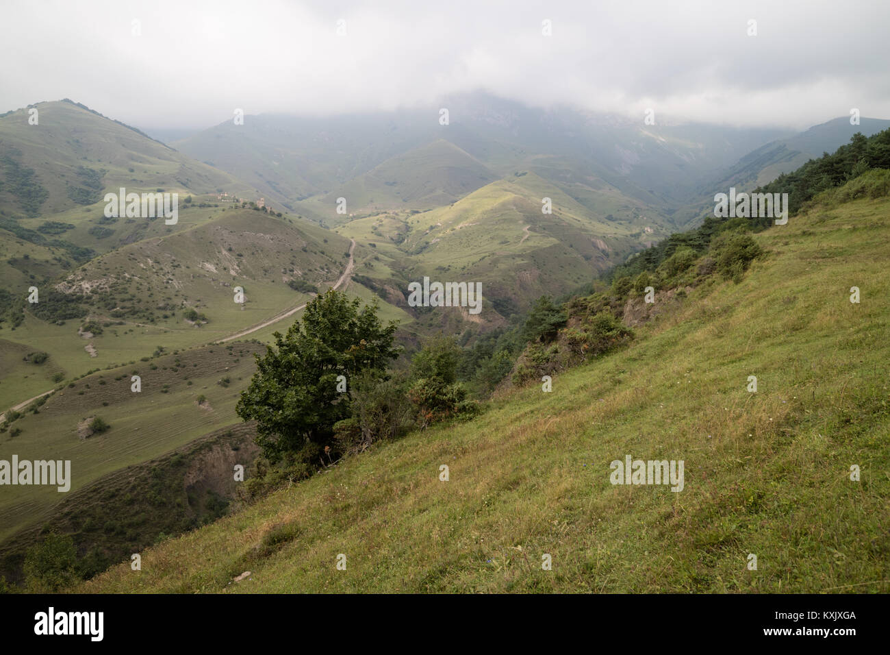 Valley of Caucasian mountains in Ingushetia/Chechnya, a 150-kilometer (90 mi) stretch of the Caucasus Mountains runs through the territory Stock Photo