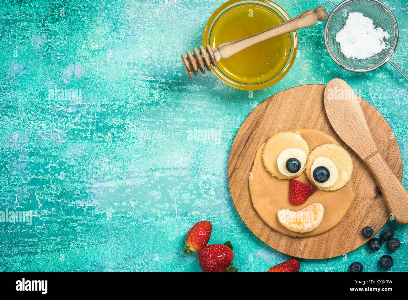 Making perfect pancakes for kids on Shrove Tuesday, copy space border background Stock Photo