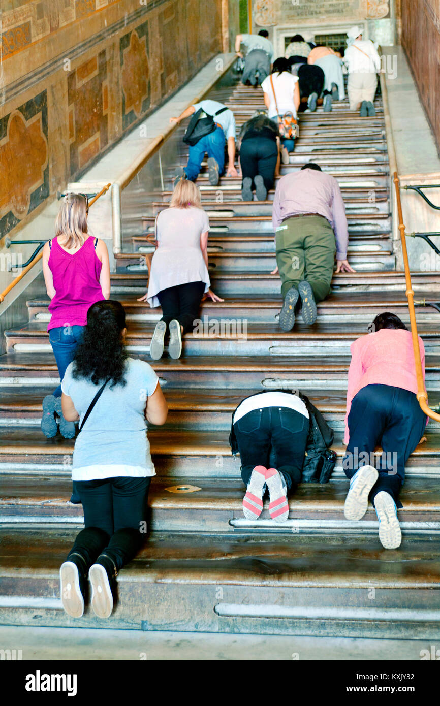 Climbing the holy Scala Sancta Stairs, Rome, Italy Stock Photo