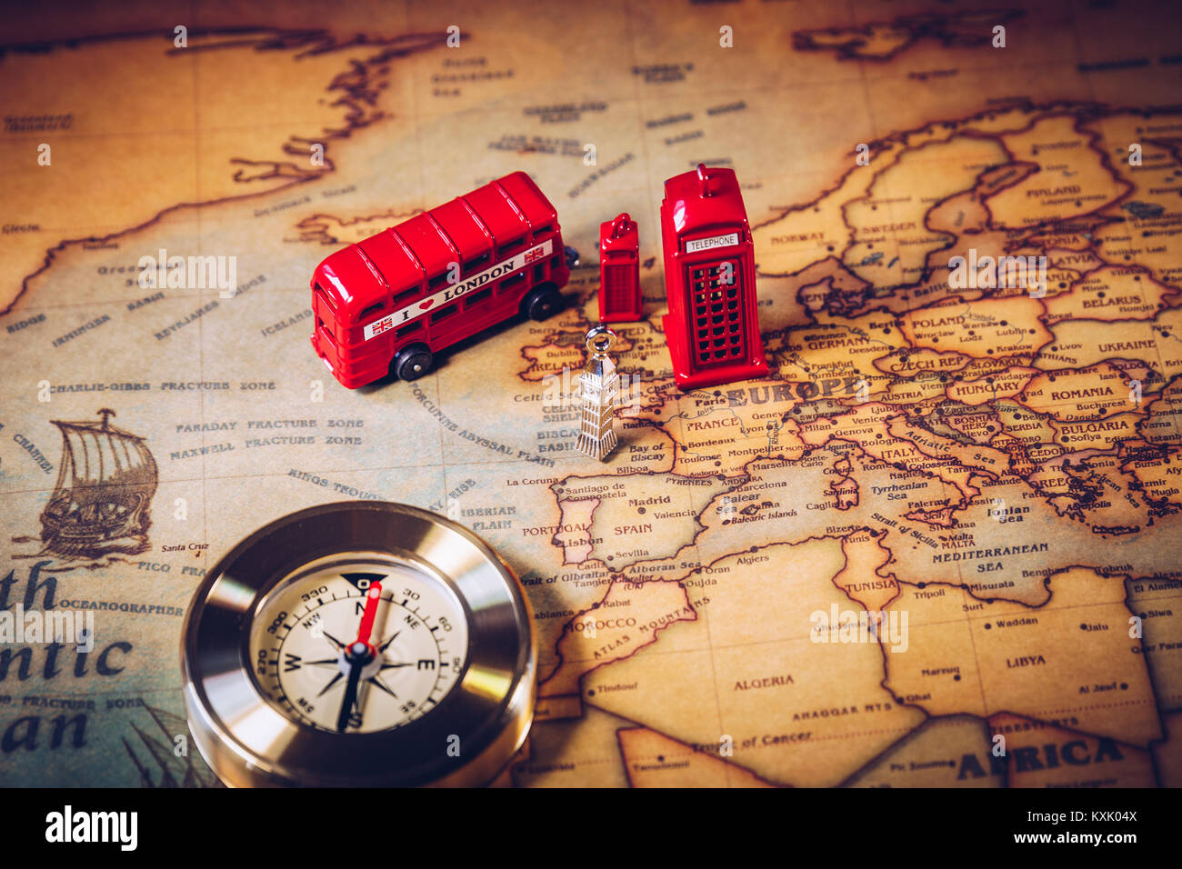 London map with Big Ben, double decker bus in miniature and compass, travel concept. England, UK. Stock Photo
