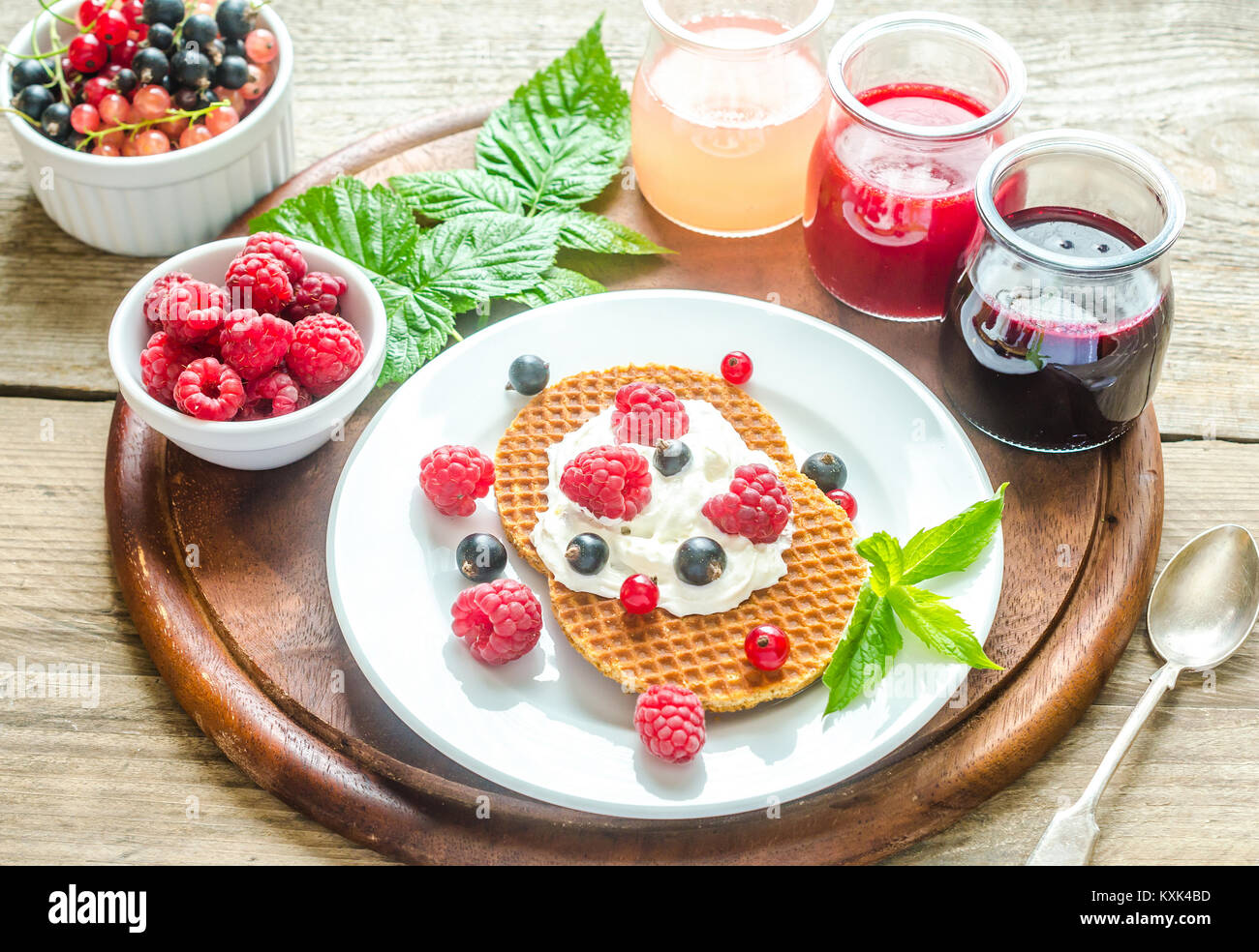 Belgian waffles with whipped cream and fresh berries Stock Photo - Alamy