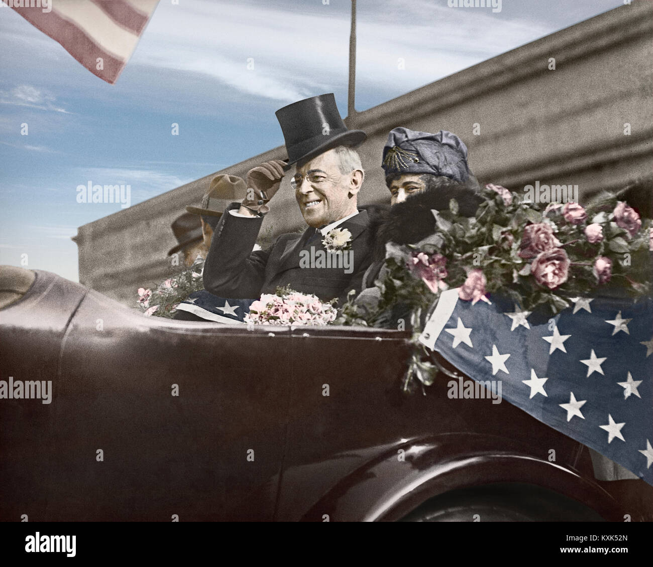 President Woodrow Wilson and his wife Edith in an open parade car on tour seeking support of the League of Nations. September 1919. Image colorized from original camera 5 x7 inch glass negative. Stock Photo
