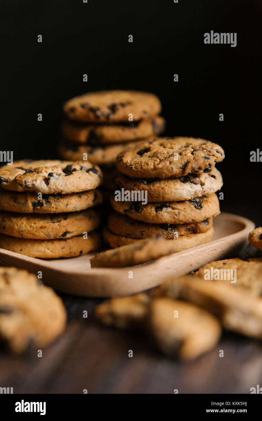 Close-up of cookies in tray on table against black background Stock Photo