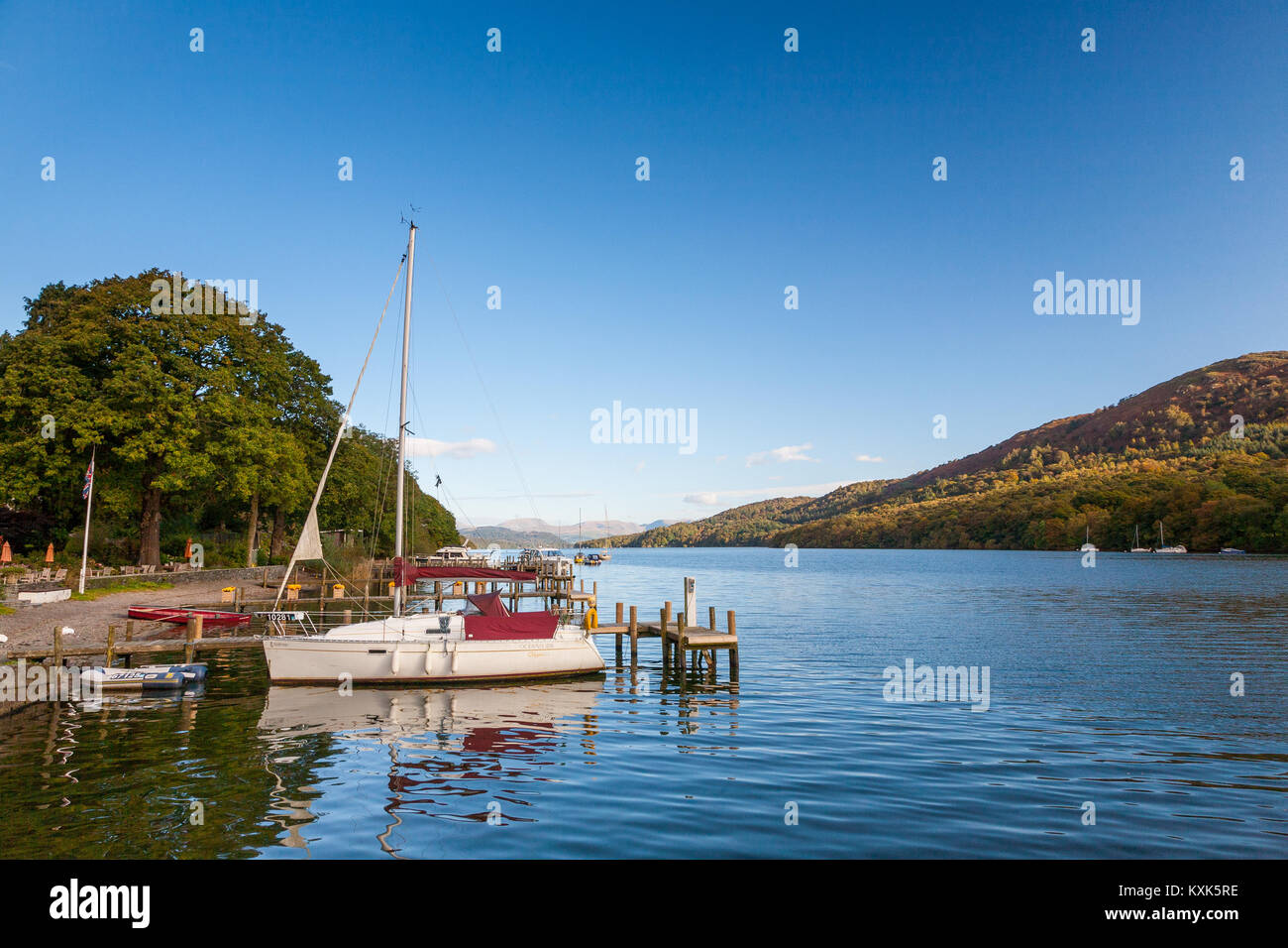 A sailing boat moored at Lakeside, Lake Windermere, Cumbria UK Stock Photo