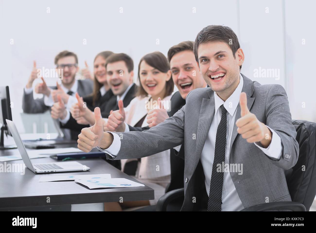 successful business team showing thumbs up Stock Photo - Alamy
