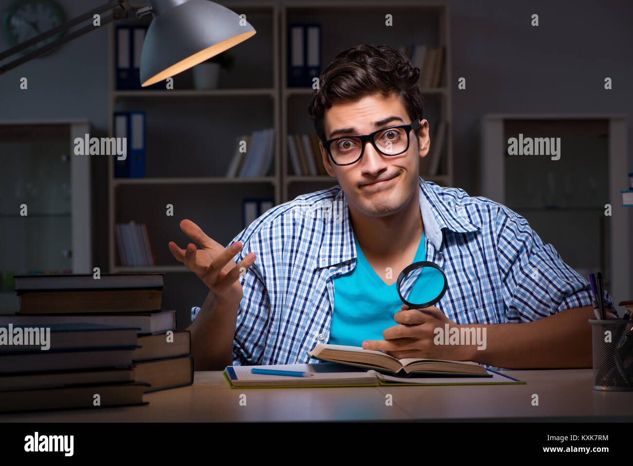 Student preparing for exams late night at home Stock Photo - Alamy