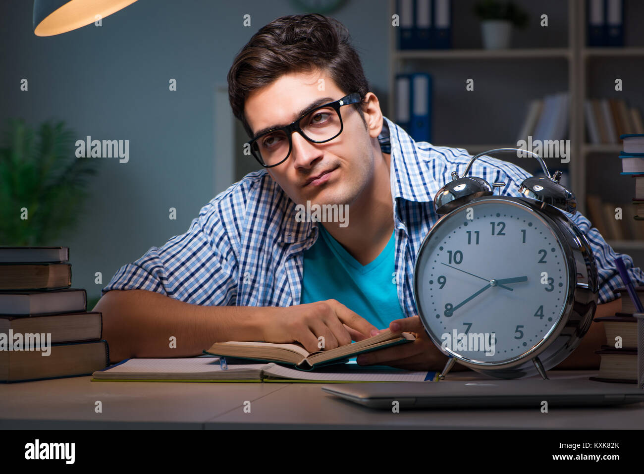 Student preparing for exams late night at home Stock Photo - Alamy