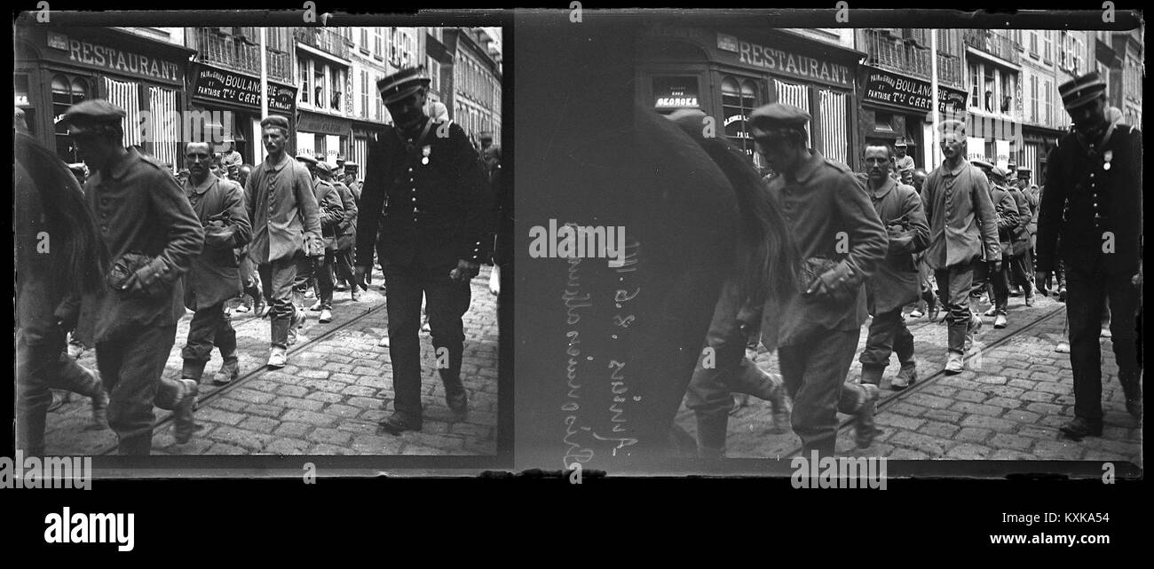 This 1915 photograph from Amiens, France, shows German prisoners of war during World War I. The image reflects the conditions and historical context of the conflict, offering a snapshot of wartime life and its impact on soldiers. Stock Photo