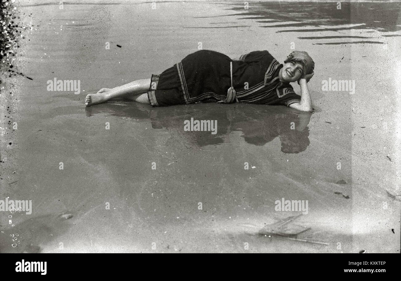 This photograph shows bathers on La Concha beach in Spain, illustrating ...