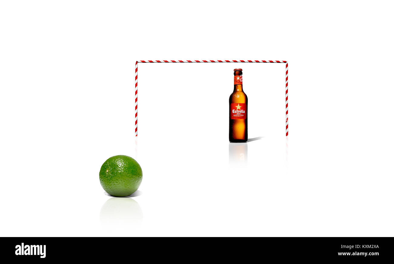 A cut out shot of a football goal made out of drinking straws, a bottle of Estrella lager and a lime, simulating a football scene Stock Photo