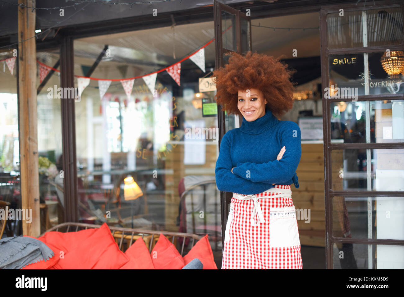 Cafe owner smiling camera hi-res stock photography and images - Alamy