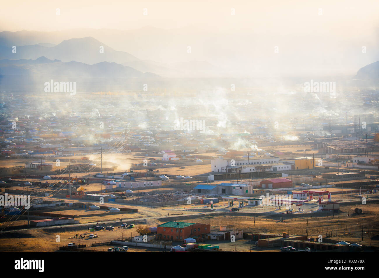 Khovd Hovd town city sunset smoke chimneys burning coal to stay warm