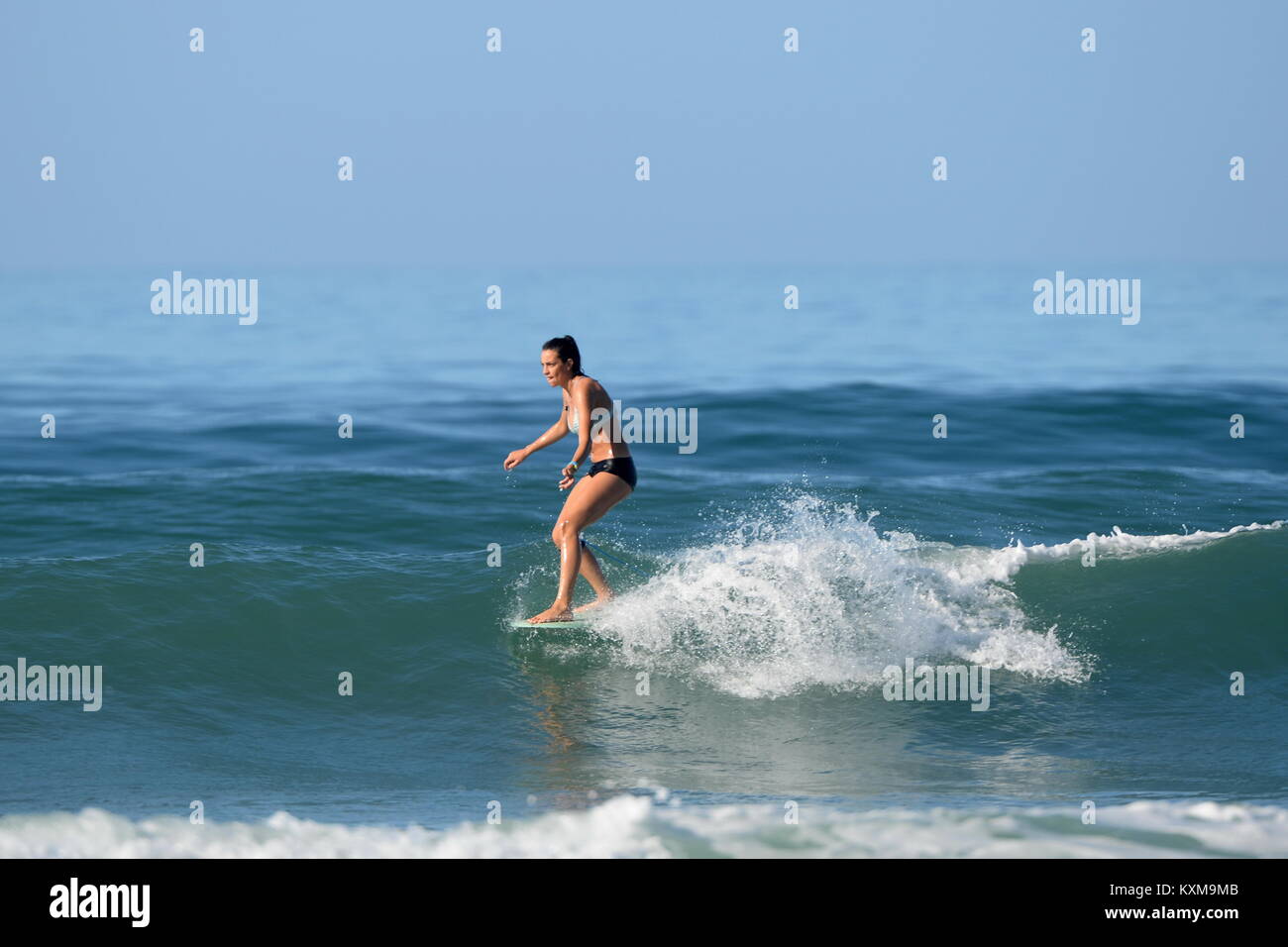 Surfing in Costa Rica .Girls hang five Stock Photo: 171321035 - Alamy