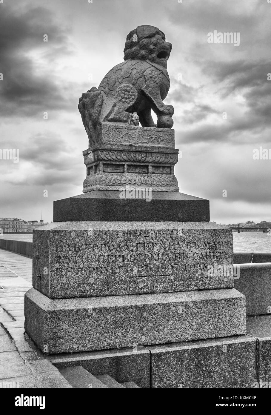 Sculpture of the Chinese lion Shih Tzu brought from the Chinese city of Girin on the Petrovskaya embankment near the Neva River against the backdrop o Stock Photo